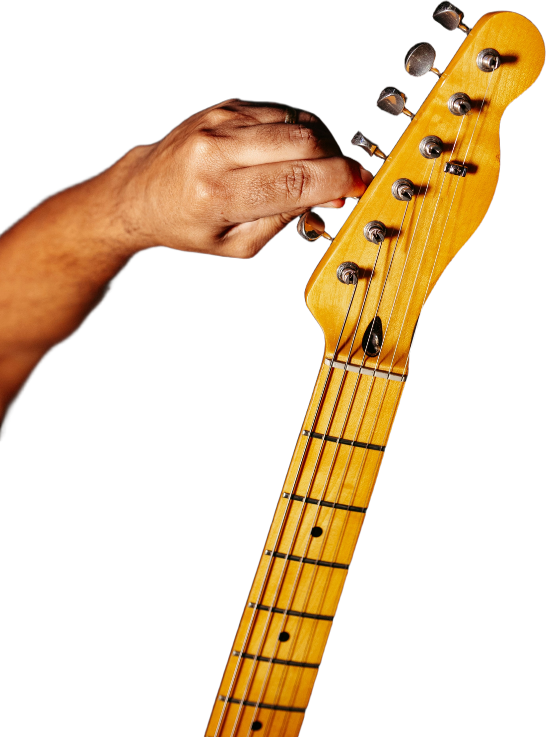 Close-up of a student adjusting the tuning pegs on an electric guitar.